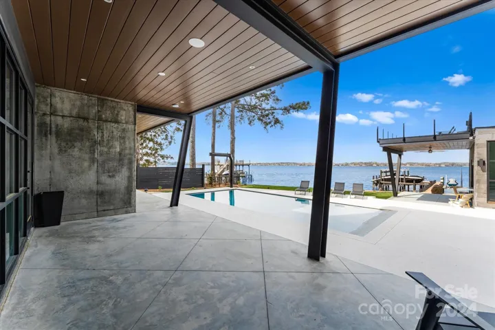 Pool deck with covered patio.