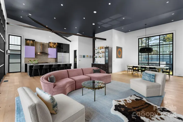 The open-concept family room, kitchen, and dining area flow seamlessly.
