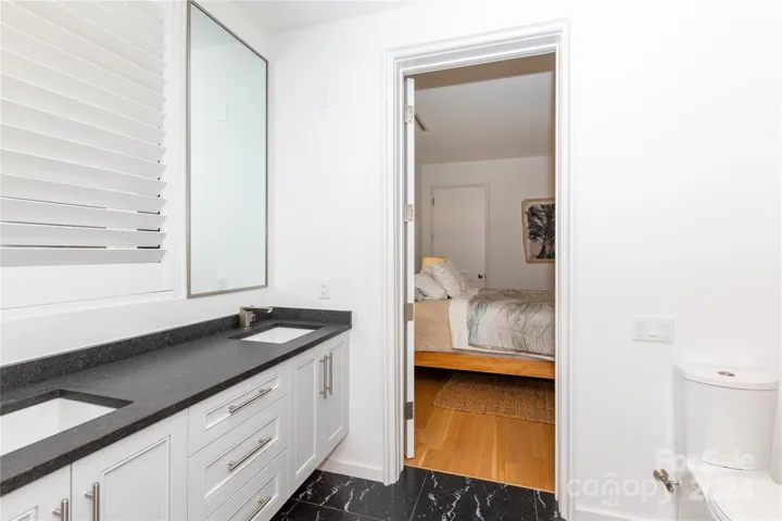 Dual access bathroom with a bathtub