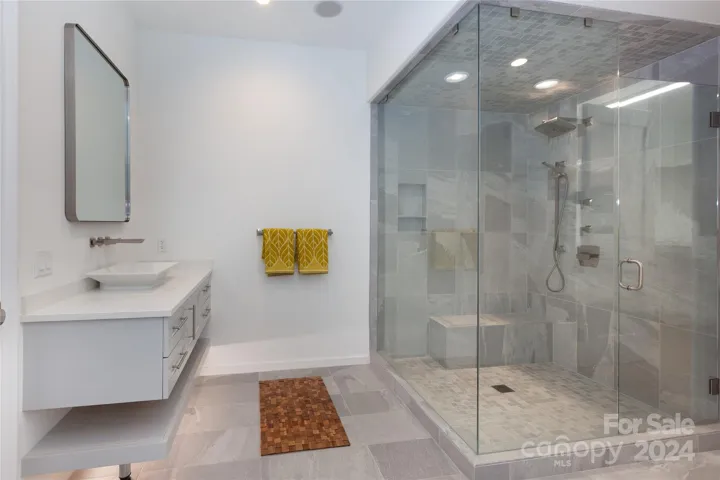 Large walk-in shower with bench