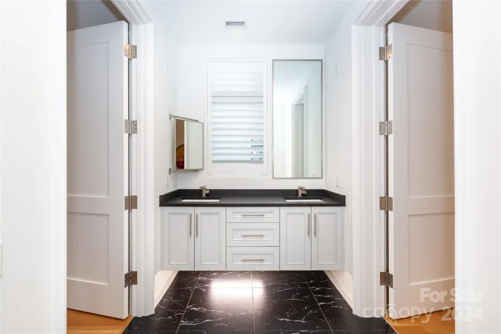 Dual access bathroom with a bathtub