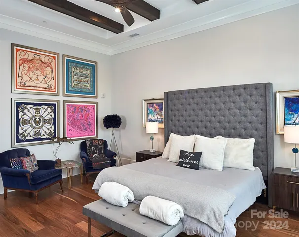 Primary suite has beamed ceilings.