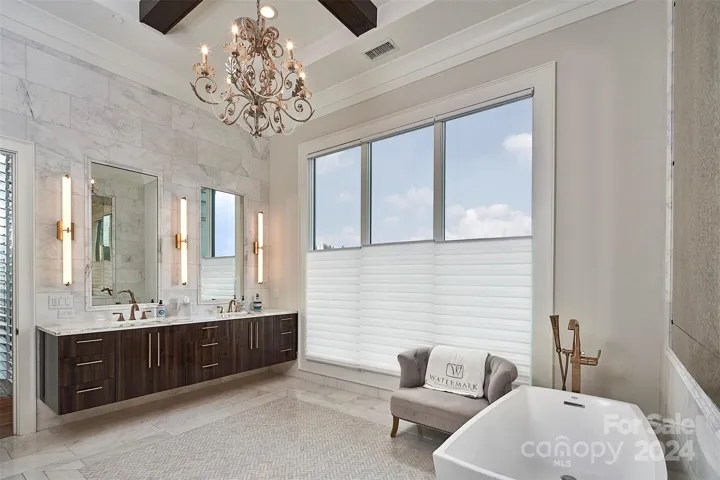 Floating double vanities in modern Tierra Elm finish.