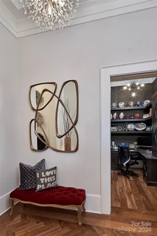 Foyer has windowed pocket door leading to office.