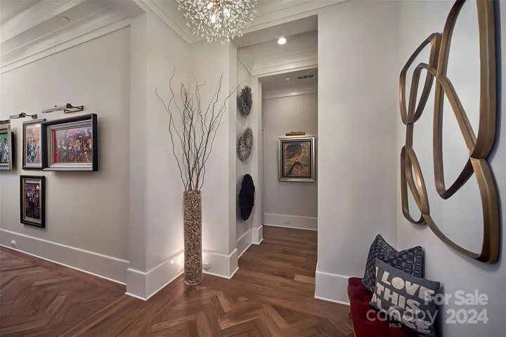 Elevator opens into your Penthouse with 12-14" ceilings and herringbone detailed walnut floors.