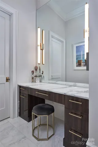Additional vanity area in primary.  Heated marble floors keep your toes warm all year round.