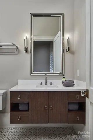BR #3 en suite has floating James Martin vanity, heated marble floors, and walk in shower with bench.