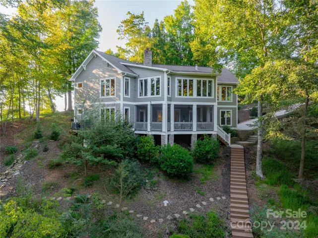 Welcome to this stunning custom-built waterfront home with breathtaking lake views from nearly every room!