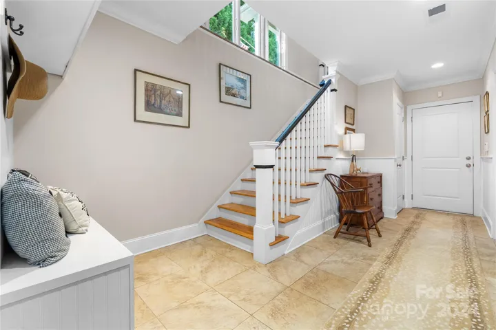 Stairs leading into finished basement