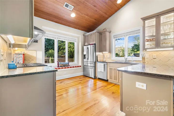 Spacious kitchen with a ton of natural light, stainless steal appliances and a gas range!