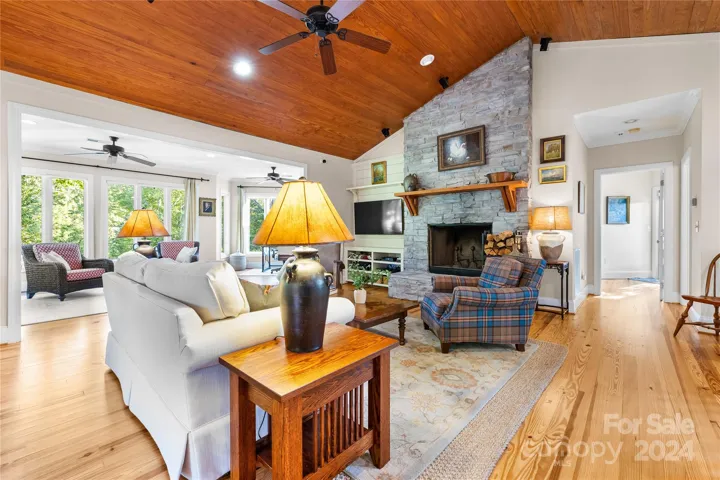 Step ontowhite pine floors bathed in natural light & admire the tongue & groove cathedral ceiling in the living room, all within aseamless open floor plan.