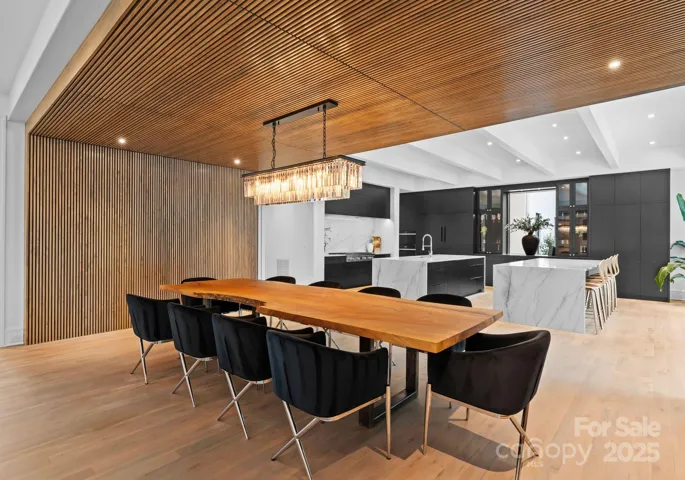 Dining area with maple louvered wall and ceiling panels