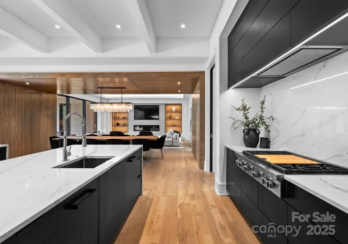 Gourmet kitchen with 48 inch Wolf range with 4 burners and 2 griddle areas