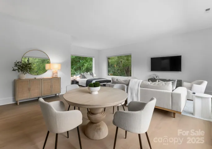 Upper level guest apartment #2 bedroom with rear staircase leading to side entrance on main  level