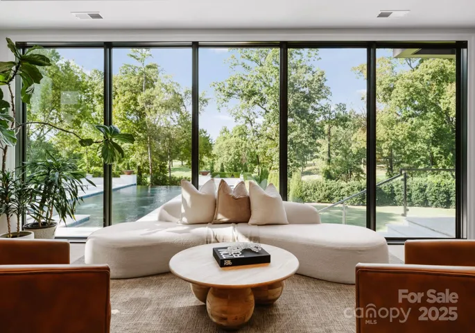 Sitting area off the kitchen area overlooking the expansive pool deck
