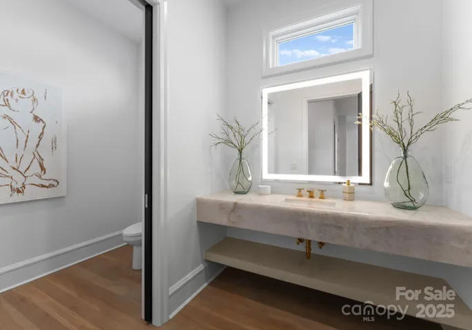 Main level powder room with floating marble sink