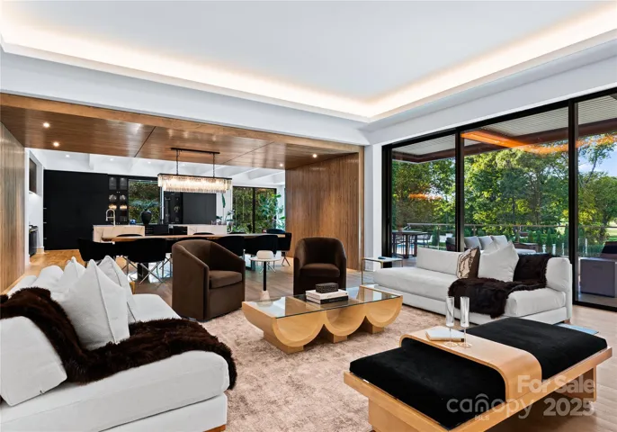 Great Room with nano wall 18 ft. wide 3-panel stacking door leading out to upper level terrace