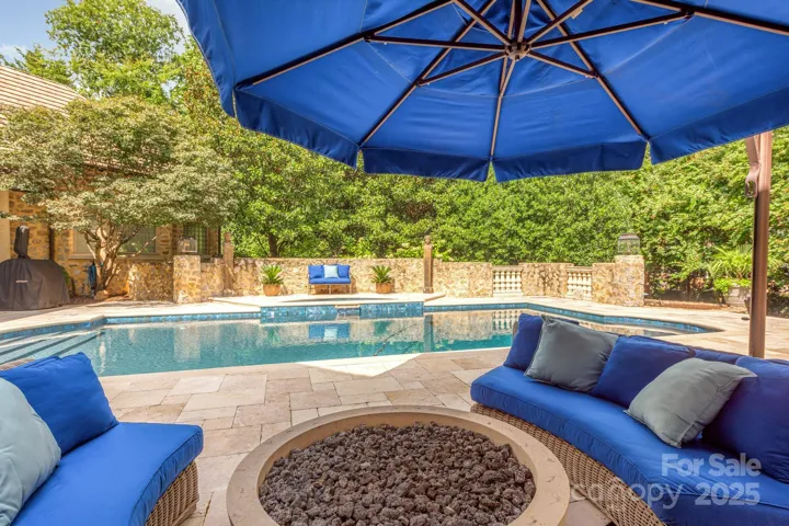 Completely private, stone and travertine adorned pool deck.