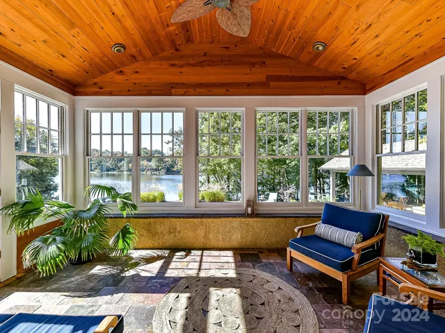 Sunroom with a view to pool, hot tub, lake and sauna