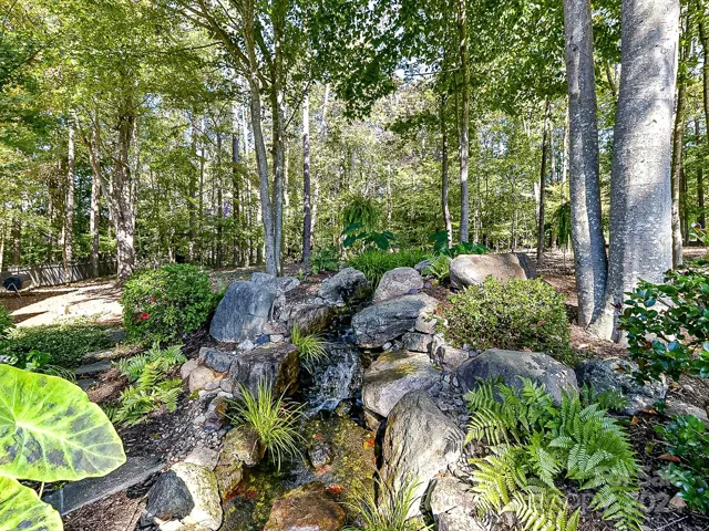 Water feature in the front porch area with koi fish (fish to not convey family pets)