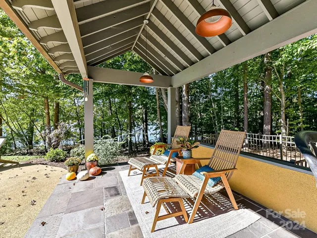 Covered outdoor bar area with access to pool half bath and sauna.
