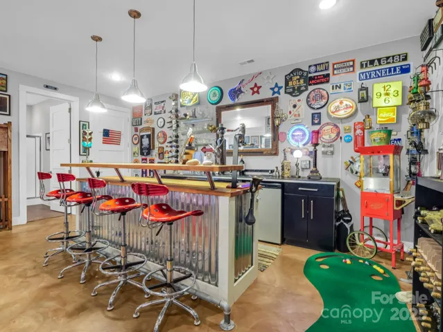 Lower level bar set-up w/elevator to the left & full BA
