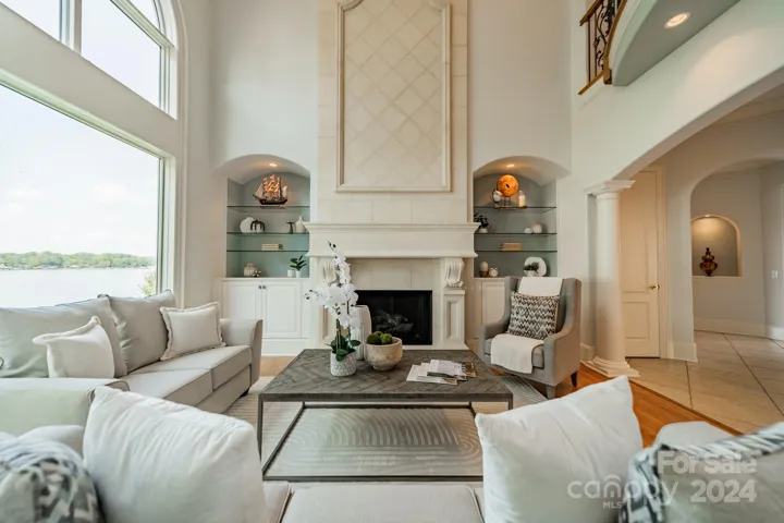 Stately fireplace in the livingroom with lake views