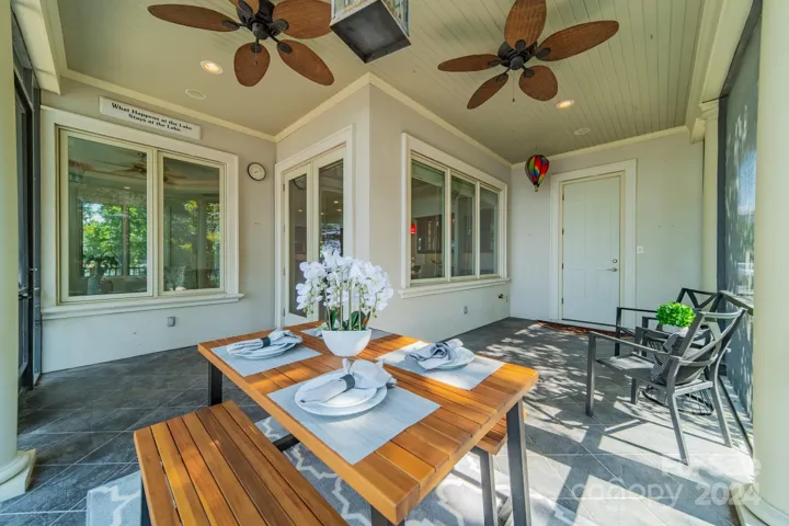 Screened patio - there is a door to a half bath for convenience to the pool