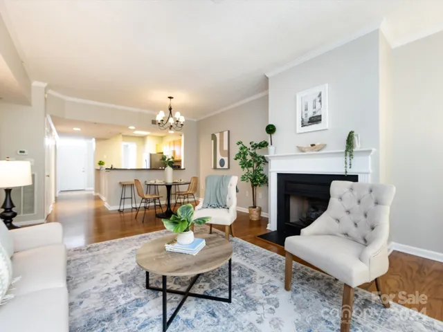 Living Room with gas fireplace & crown molding & open to Dining Area!