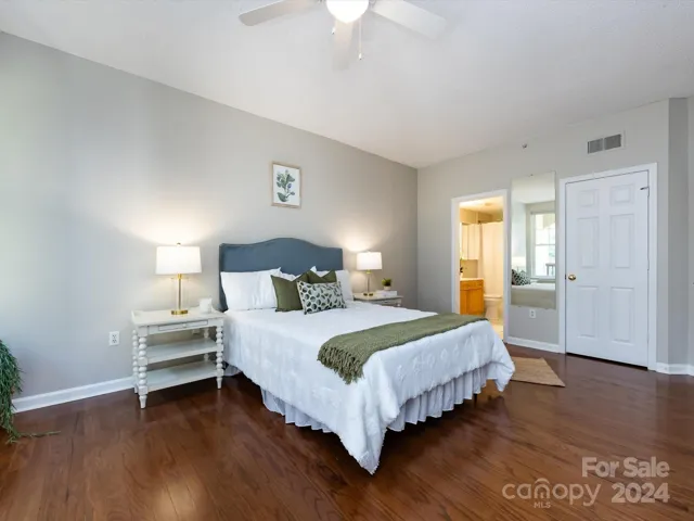 Spacious Primary Bedroom with private balcony access, walk in closet & private bath!