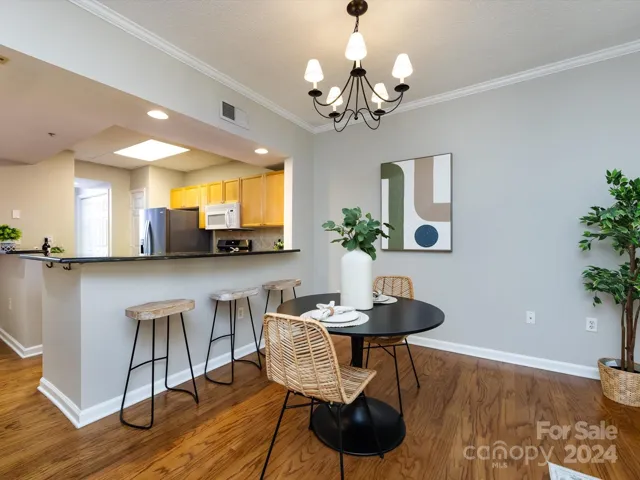 Dining Area with crown molding & hardwoods!