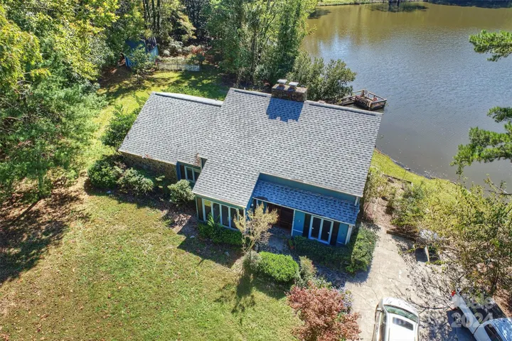 Aerial view of home and lake