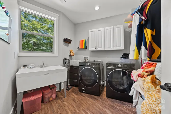Laundry room with large utility sink.