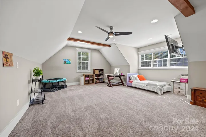 Upstairs bedroom/game room/flex space (over garage). Bedroom #3.