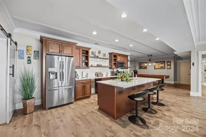 Second full kitchen with island.