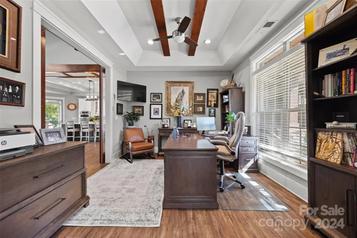 Office with two sets of glass barn doors.