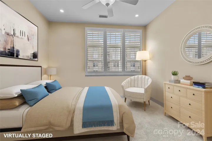 Second bedroom, currently used as a home office, virtually staged to show as a bedroom.