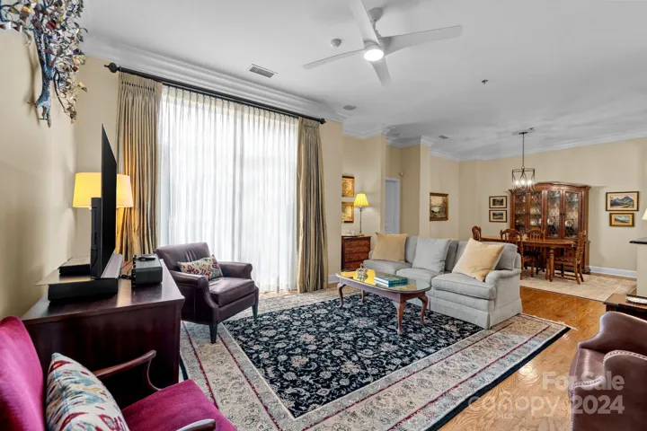 Spacious living room combines style and function, creating a comfortable, refined setting ideal for daily living and social gatherings.