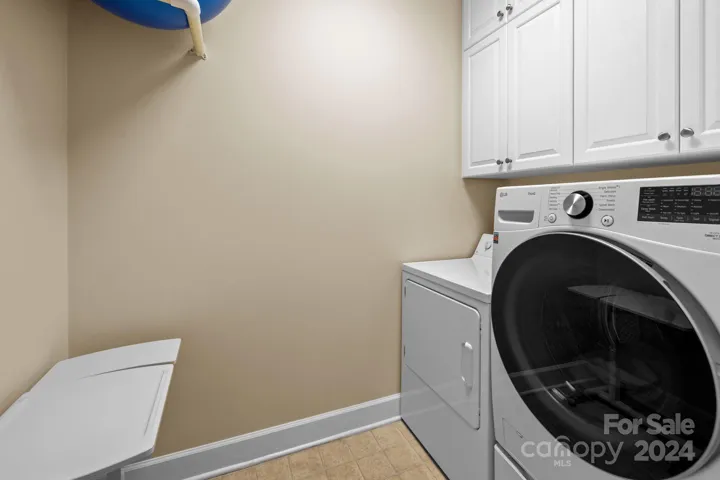 A separate laundry room with storage, closet, and room for large, front load washer/dryer. Both washer and dryer convey.