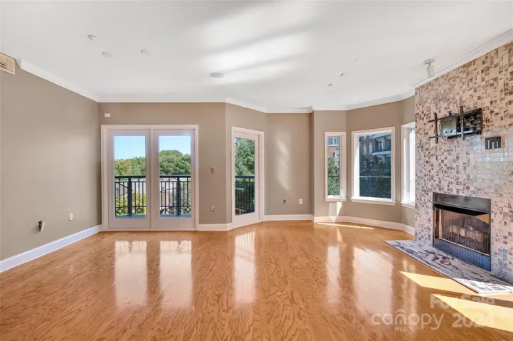 Living and dining room leading to the balcony. Bringing the outdoors in!