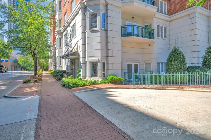 The inviting neighborhood streets of the 4th Ward.  Gated, unground parking to the right.