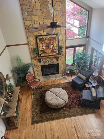 View of great room from loft of primary bedroom.  Brand new ceiling fan.