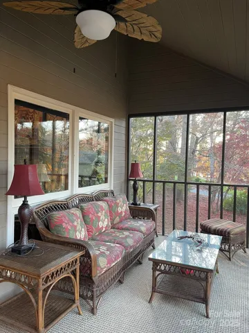 Screened-in porch with new ceiling fan and all new paint is great to sit in to enjoy all weather days of Lake Norman!
