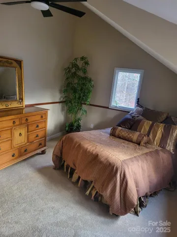 Front side upstairs bedroom with new ceiling fan and walk-in closet. Brand new carpet!