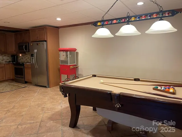 View into rec room/ kitchen area. Pool table and billiard light included!