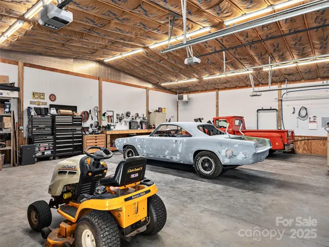 Clean, spacious work area for multiple vehicles.