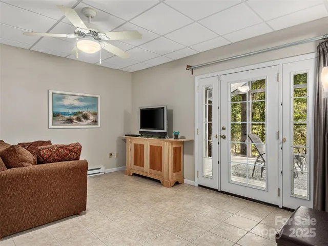 Living area in apartment with access to screened porch