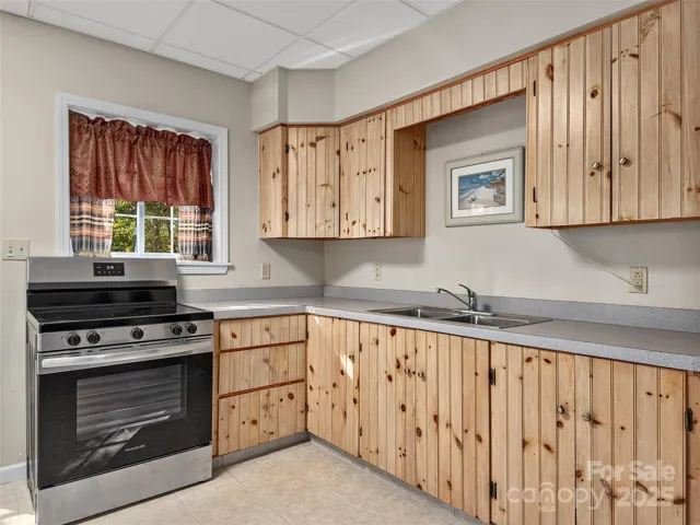 Lower Level Apartment full kitchen.  To the left of stove is the Door to outside firepit.