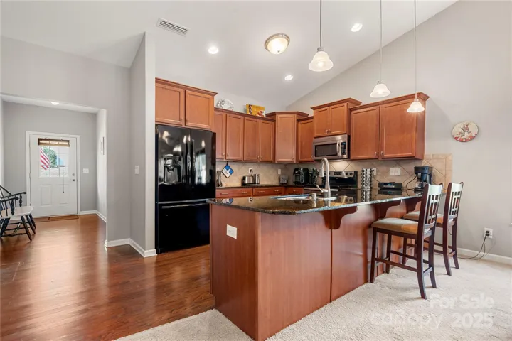 Huge Kitchen with eat at bar and ample cabinetry