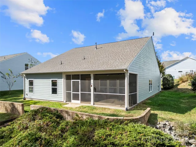 Spacious, screened in rear porch with additional yard space